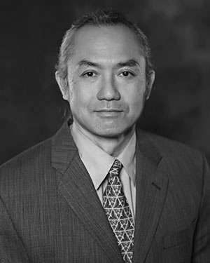 Headshot of Makoto Saigusa wearing a suit